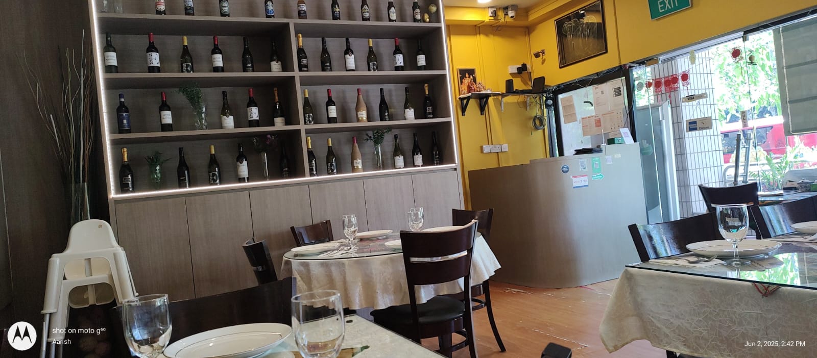 Dining tables beside the wine display at Indian Curry House
